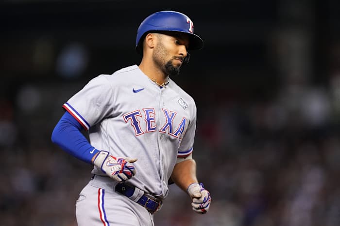 Oct 31, 2023; Phoenix, Arizona, USA; Texas Rangers second baseman Marcus Semien (2) reacts after hitting a three run home run against the Arizona Diamondbacks during the third inning in game four of the 2023 World Series at Chase Field. Mandatory Credit: Joe Camporeale-USA TODAY Sports